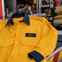 Load image into Gallery viewer, Navy blue name patch with yellow text, close-up view